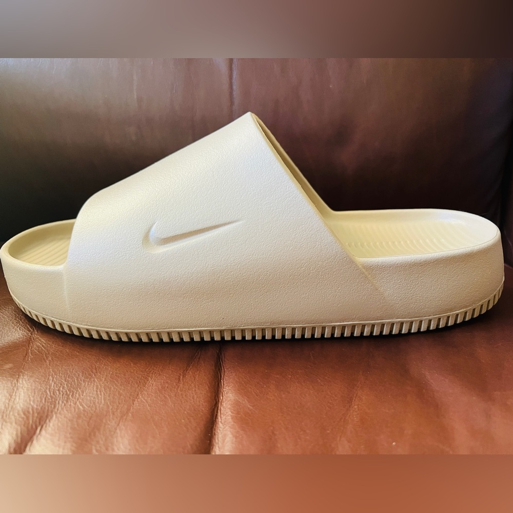 NWT. Never worn. Men size 11 Nike Calm Slide. Khaki.